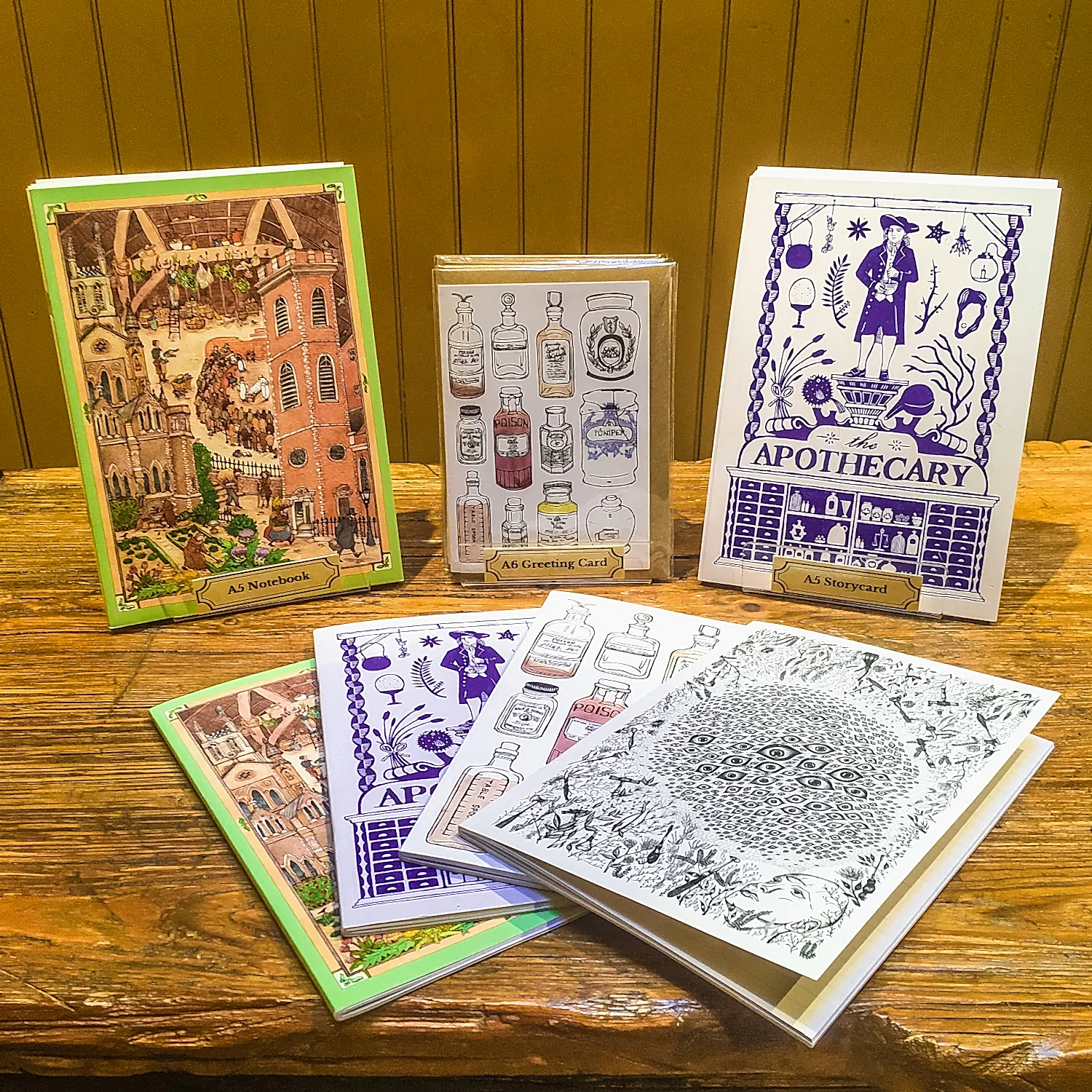 A selection of notebooks in four different designs, displayed on the old operating table