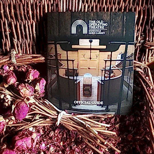 The guidebook displayed in a basket of dried rose petals