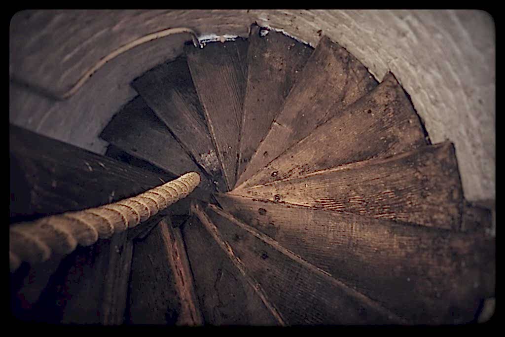 A view down the spiral wooden staircase