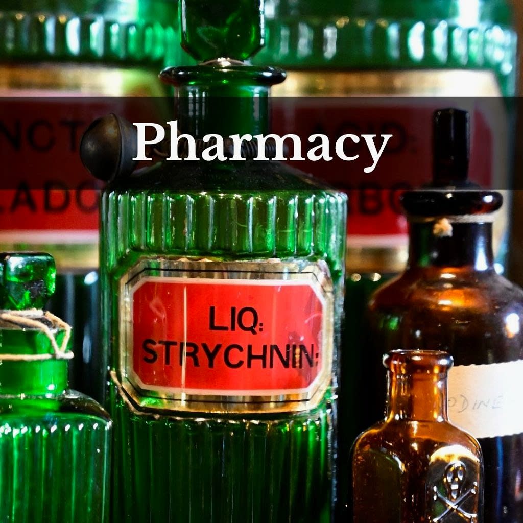 Word 'pharmacy' over glass bottles
