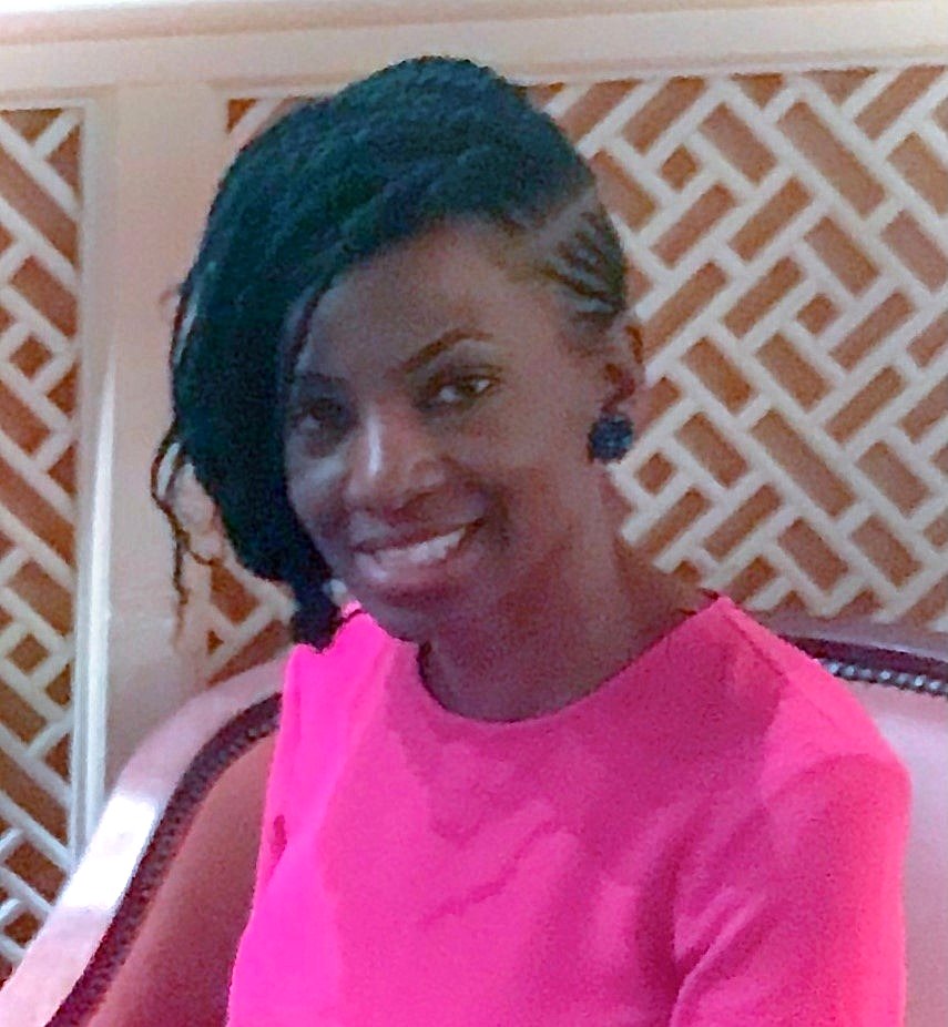 Headshot of a woman dressed in pink