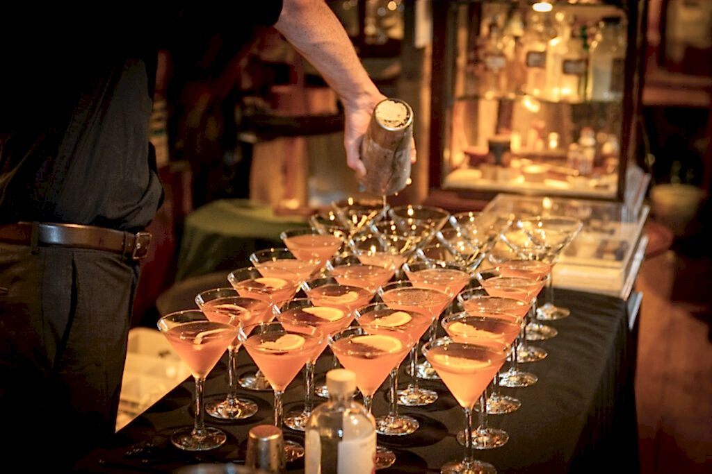 Cocktails being poured into glasses